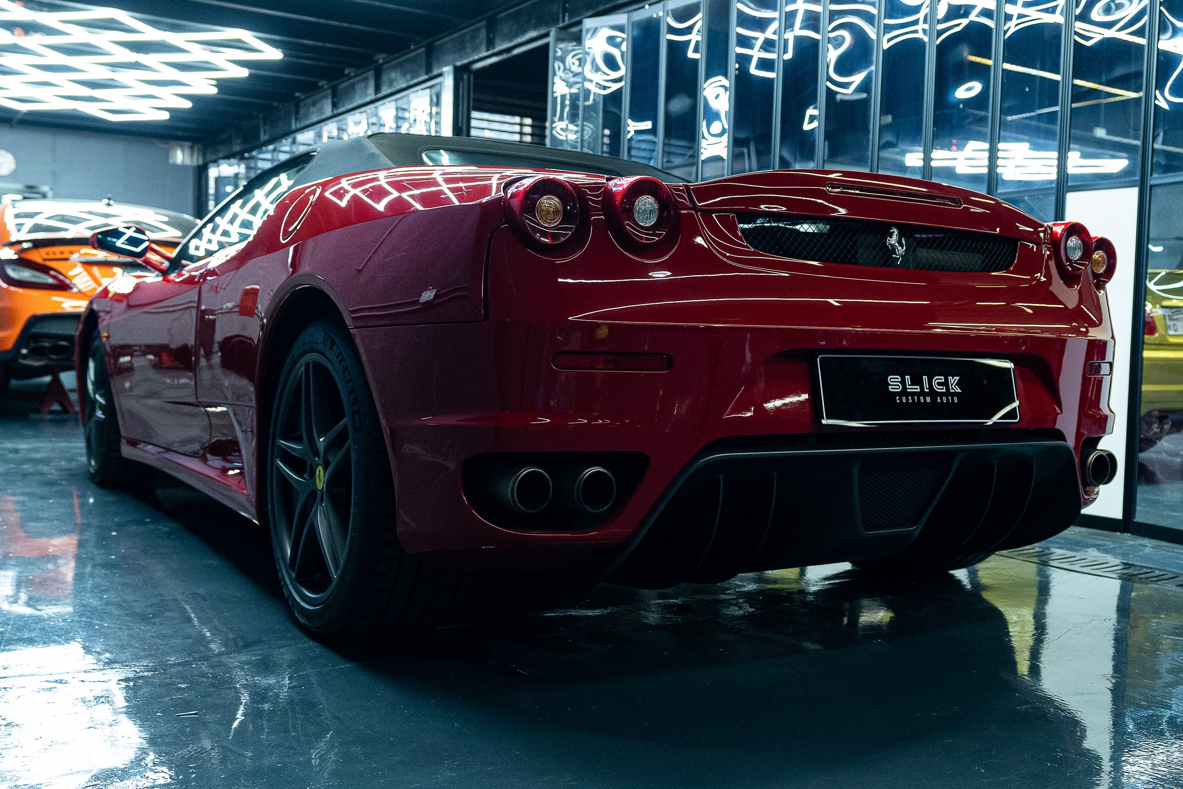 A red Ferrari inside the detailing studio