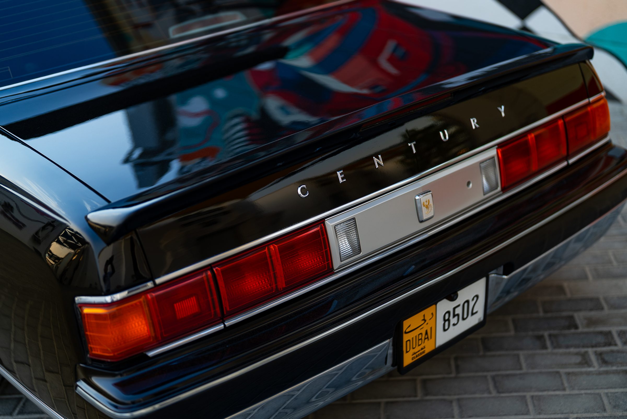 The rear of a Toyota Century photographed outside the workshop